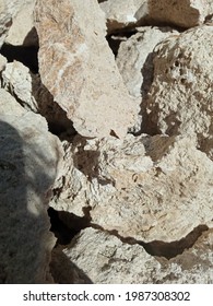 Rocks And Sun In The Corner Of The House, There Are Many Piles Of Stones They Seem Like Sunbathing Enjoying The Day And As If Saying Calm Down Friends Enjoy Life You Are Amazing You Are Great Sometime