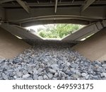 rocks underneath a bridge