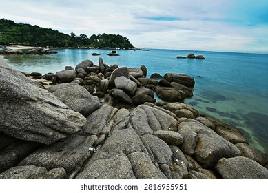 Rocks withstand the waves at the beach