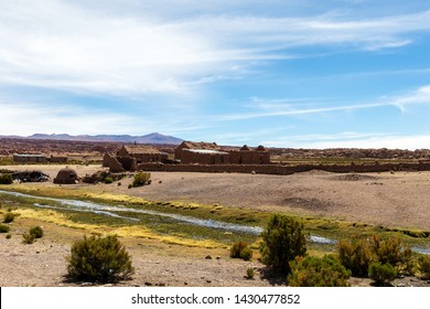 Rocky and arid mountain landscape : Desert valley with rocky hills under bright blue sky in Bolivian Altiplano, Bolivia