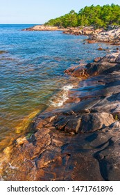 Rocky beach in a archipelago with a forest