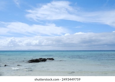 Rocky Beach with Clear Water - Powered by Shutterstock