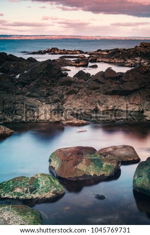 Similar – Image, Stock Photo Beach with rocks and puddle in a sunset, ribadeo, lugo, galician, spain