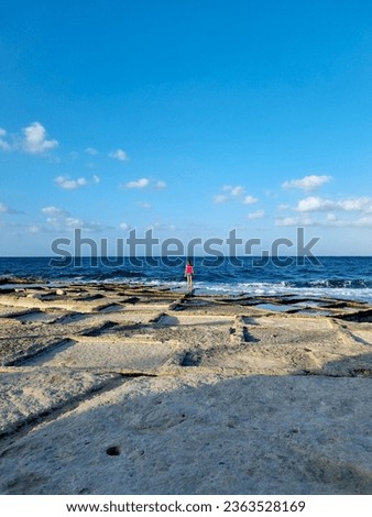 The rocky beach of Marskala Malta with salt pans, Mediterranaen Sea waves