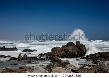 Rocky beach at Tsaarbank in West Coast national Park, Langebaan with waves crashing on the rocks.