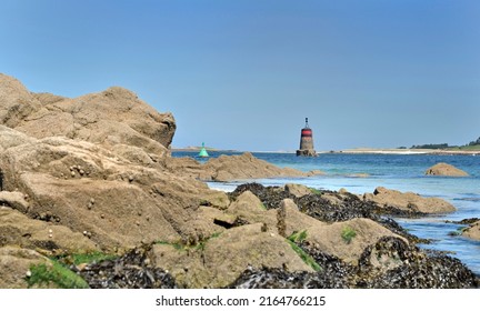 Rocky Beach  View With Beacon  Background In Aber Benoit, Brittany- France