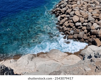 Rocky cliff blue ocean waves - Powered by Shutterstock