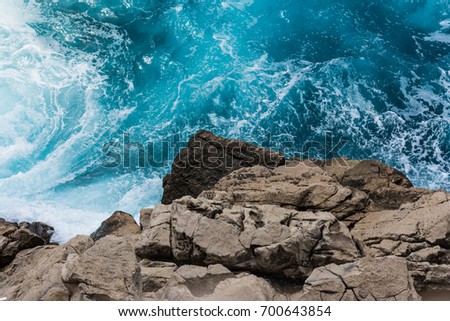 Rocky Cliff Contrast From Above with Crashing Blue Water Whitecaps  Perspective