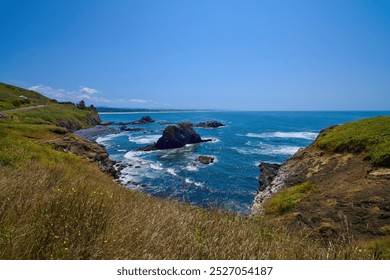 Rocky cliffs and the Marine Garden walls in the Yaquina Lighthouse Natural Area. - Powered by Shutterstock