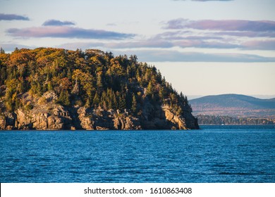 Rocky Cliffs On A Forested Island In Fall Colors In Bar Harbor, Maine, USA