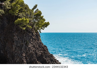 Rocky coast with cliffs and seascape (Mediterranean sea - Ligurian sea) between the small village of Framura and Bonassola, Cinque Terre, La Spezia province, Liguria, Italy, southern Europe. 