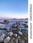 Rocky coast of the gulf of finland at sunset. Summer in Finland