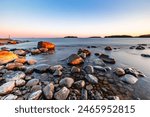 Rocky coast of the gulf of finland at sunset. Summer in Finland