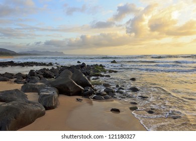 The Rocky Coast Of Kauai, Hawaii At Sunrise.