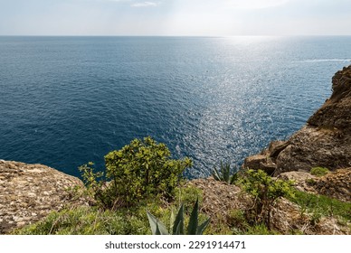 Rocky coast and Mediterranean Sea (Ligurian Sea) between Camogli, San Fruttuoso and Portofino village. Tourist resort in Genoa Province (Genova), Liguria, Italy, Europe.