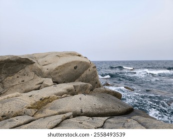 Rocky coast with wild waves on the island of Sardinia - Powered by Shutterstock