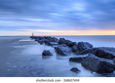 Rocky Coastal Landscape Of North End Of Folly Beach Near Morris Island Lighthouse In Charleston, SC.