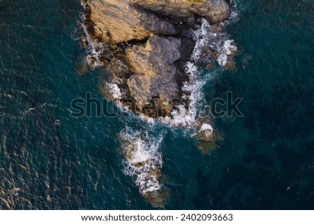 Similar – Aerial Drone View Of Dramatic Ocean Waves Crushing On Rocky Landscape