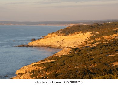 Rocky coastline along the ocean, rugged cliffs meeting waves, scenic oceanfront view, dramatic rocky shore, crashing waves on rocks, natural seaside landscape, coastal beauty, wild and untouched natur - Powered by Shutterstock