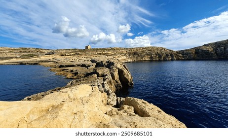 Rocky Coastline and Azure Waters at Dwejra, Gozo, Malta - Powered by Shutterstock