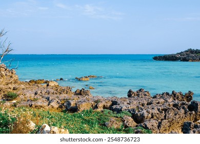 Rocky coastline and clear blue sea water on the tropical island of Yoron, Kagoshima prefecture, Japan - Powered by Shutterstock