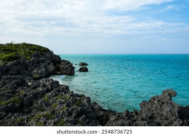 Rocky coastline and clear blue sea water on the tropical island of Yoron, Kagoshima prefecture, Japan - Powered by Shutterstock