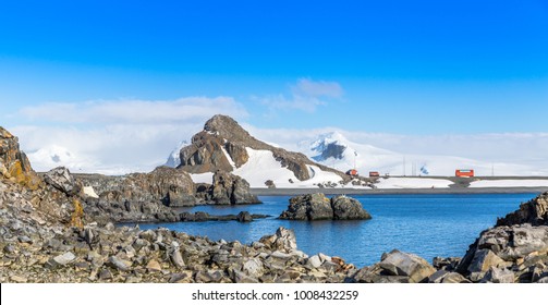 Rocky coastline panorama with snow mountains and polar research station buildings, Half Moon island, Antarctic peninsula - Powered by Shutterstock