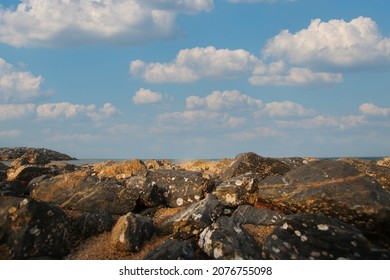 Rocky Coastline Scenery At The Ocean Shore Low Angle Photo Looking Up At The Sky