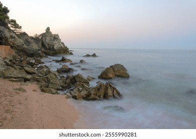 Rocky Coastline at Twilight and smooth misty water. - Powered by Shutterstock