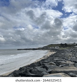 Rocky coastline under dramatic cloudy sky