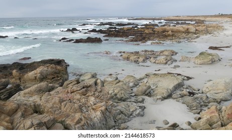 Rocky craggy pacific ocean coast, sea water waves crashing on rocks, 17-mile drive, Monterey, California USA. Gloomy nature near Point Lobos, Big Sur, Pebble beach. Dramatic cloudy rainy cold weather. - Powered by Shutterstock