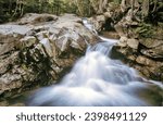 Rocky gorge and powerful waterfall along the Pemigewasset River upstream from The Basin in New Hampshire