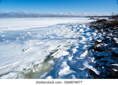 The Rocky Harbor Of Plymouth, Massachusetts Covered In Ice In The Winter.