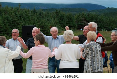 ROCKY HARBOUR, CANADA – JULY 16: Seniors dancing outdoors on July 16, 2011 in Rocky Harbour, Newfoundland. The event was part of Parks Canada’s 100th anniversary festivities.