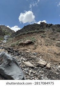 Rocky hillside with sparse vegetation