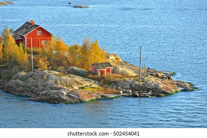 Rocky Island With Red House In Helsinki Archipelago