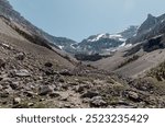 A rocky mountain valley leading the viewer