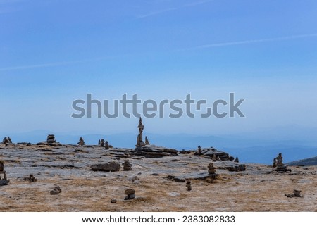 Rocky and mountainous landscape with cairns at the highest point in Portugal in Serra da Estrela Natural Park