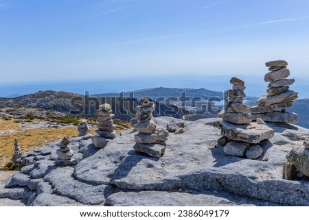 Rocky and mountainous landscape with cairns at the highest point in Portugal in Serra da Estrela Natural Park