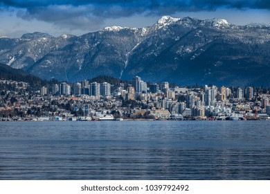 Rocky Mountains And Buildings, North Vancouver, British Colombia, Canada.