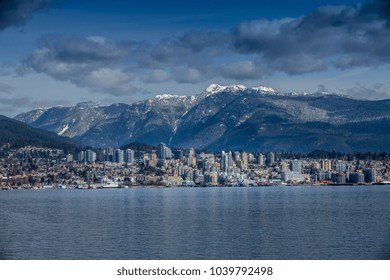 Rocky Mountains And Buildings, North Vancouver, British Colombia, Canada.