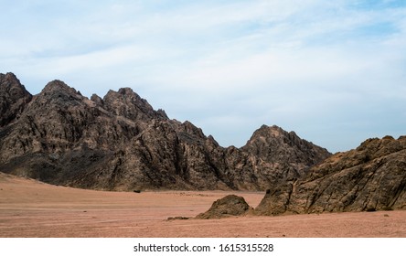 Rocky Mountains In The Desert Without People And Blue Sky With Clouds In Sharm El Sheikh Egypt Landscape