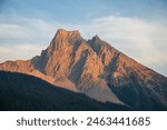 Rocky Mountains, mountain peaks, sunset, breathtaking, majestic, landscape, golden hour, vibrant, colors, alpine, scenery, twilight, silhouette, serene, tranquility, panoramic, views, dramatic, sky