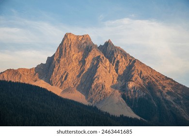 Rocky Mountains, mountain peaks, sunset, breathtaking, majestic, landscape, golden hour, vibrant, colors, alpine, scenery, twilight, silhouette, serene, tranquility, panoramic, views, dramatic, sky - Powered by Shutterstock