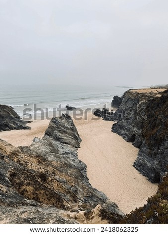 Similar – Aerial Drone View Of Blue Ocean Waves And Beautiful Sandy Beach Shore in Portugal