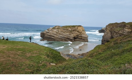 Rocky outcrop, Gentle waves, Sandy beach, Coastal scenery, Serene horizon, Cliffside beauty, Turquoise waters, Rugged shoreline, Sunlit landscape, Ocean breeze, Peaceful retreat, Scenic vista. - Powered by Shutterstock