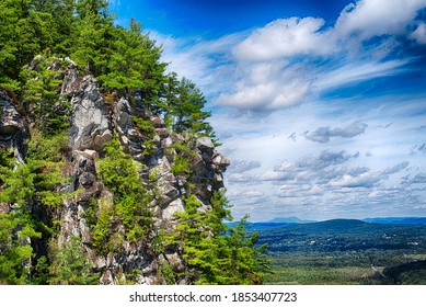 Rocky outcroppings on top of monument mountain in great barrington massachusetts on a sunny day.