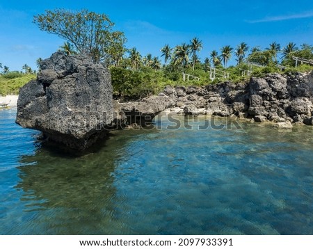 Rocky outcrops at a small coral beach in Laiya, San Juan, Batangas, Phillipines.