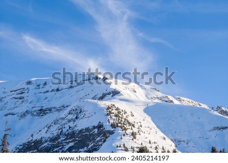 a rocky peak in the Mont Blanc massif Between Mont Joly and Aiguille Croche in Europe, France, Rhone Alpes, Savoie, Alps, in winter, on a sunny day.