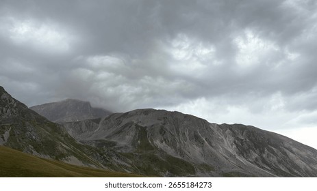 Rocky peaks with dramatic clouds